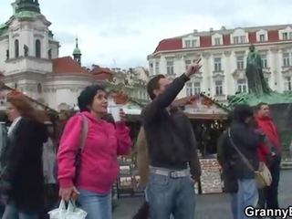 Old tourist is picked up and screwed on floor